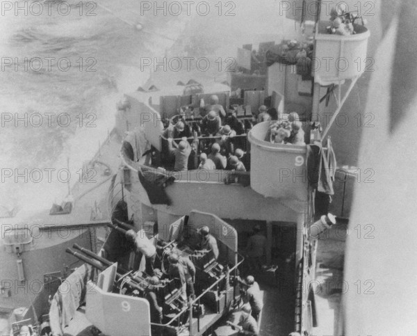 Kamikaze. Anti-aircraft gun of the battleship "Missouri" firing at a Japonese suicide plane, 1945.