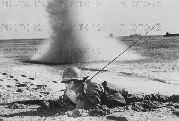 American soldier with SCR-536 Handie-Talkie (portable telephone),1944.