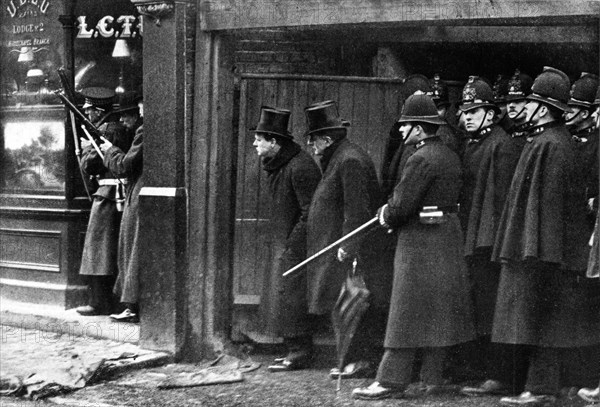 Winston Churchill attending manoeuvres in Sydney Street in London