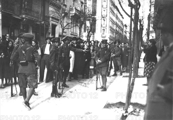 In Madrid, troops guarding a baker's shop