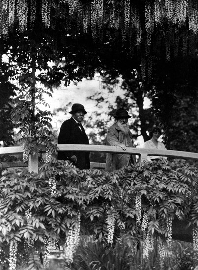 Painter Claude Monet and Clemenceau on the waterlilies bridge, at Giverny