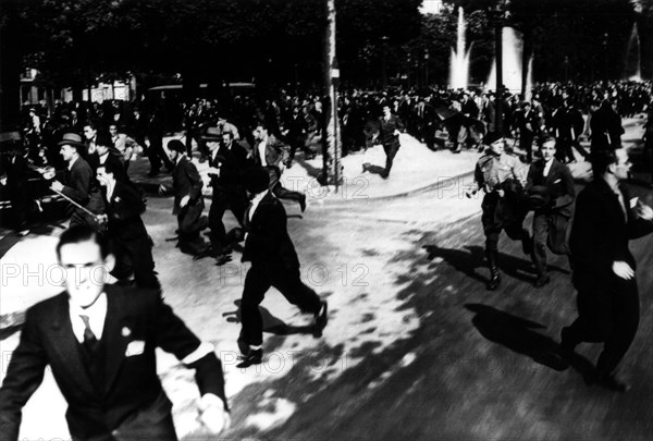 Paris, demonstrators of the group 'Action française' running away(1934)