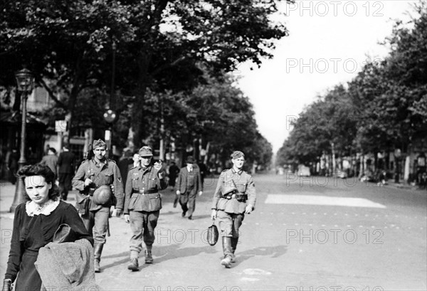 Paris, German soldiers walking down empty boulevards (1940)