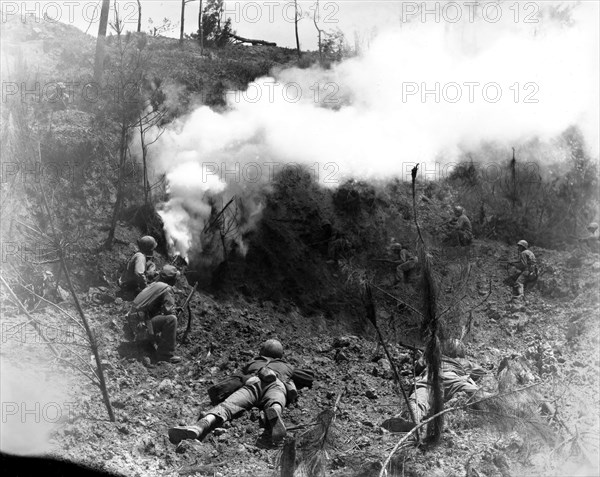 US soldier in front of the defense line of Naha, at Okinawa 'Death Valley' (1945)