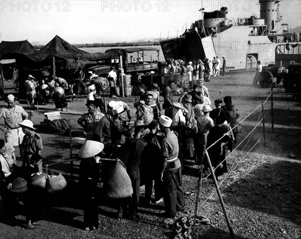 Vietnamese refugees disinfected with D.D.T. before their evacuation