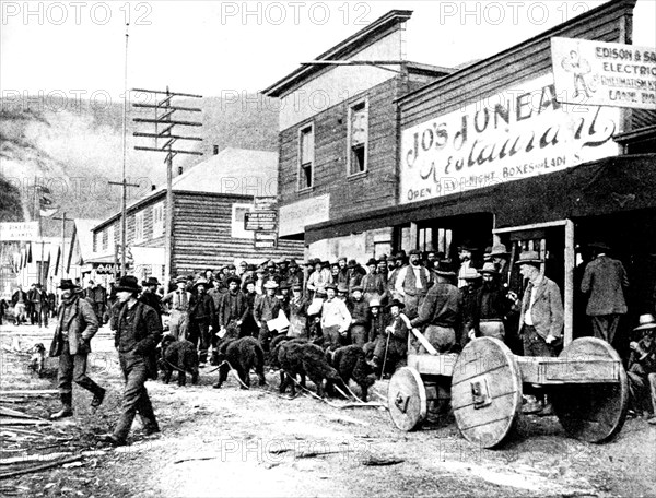 The Klondike Gold Rush: Summer car in a street of Dawson