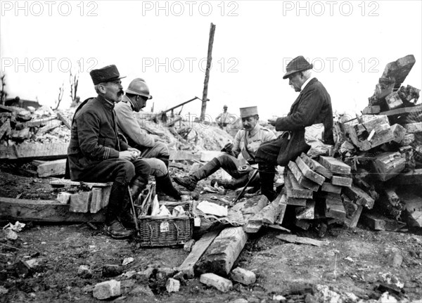 Clemenceau having lunch in the ruins of the Maurepas church, 1916