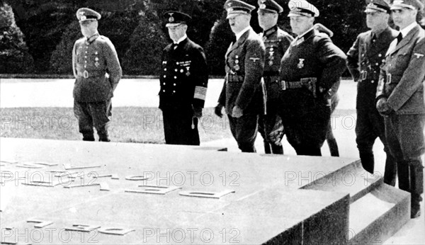 Hitler in front of the 1918 armistice plaque, in Rethondes