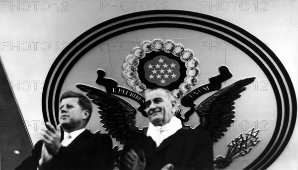 President John Kennedy and vice-president Johnson during the parade in front of the White House