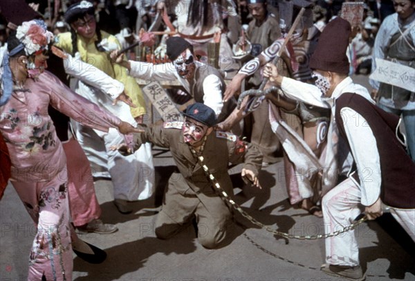 Masquerade. Stalin sentenced to death by two evil spirits because of the crimes he has committed against China