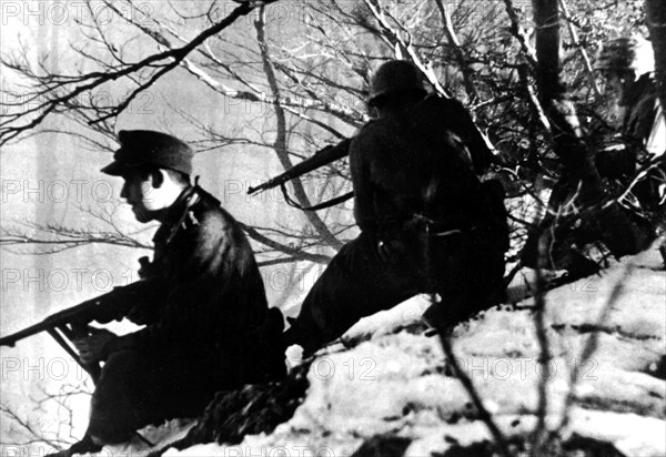 On the East front, German paratroopers defending the heights