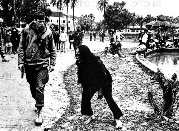 A Vietnamese, Cong-Hoa, implores an American soldier to have pity on his son, arrested in error as a Vietcong