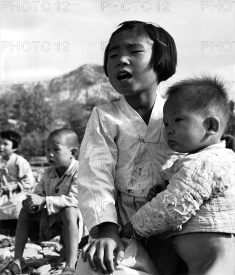 Korean war, young schoolgirl from Evur Pyung village, where school was completely razed to the ground during the war. 1950