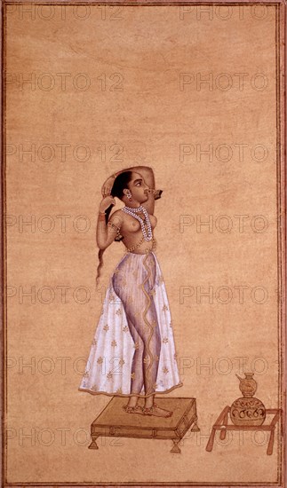 Miniature indienne. Femme se coiffant