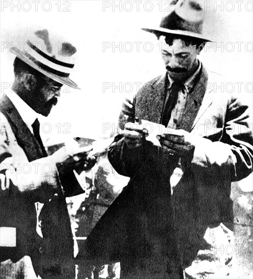 General Pascual Orozco, chief of the revolution, reads the military reports on the occupation of Ciudad Juarez