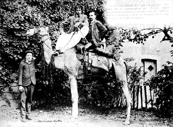 Postcard, J.B. Doussineau riding a camel