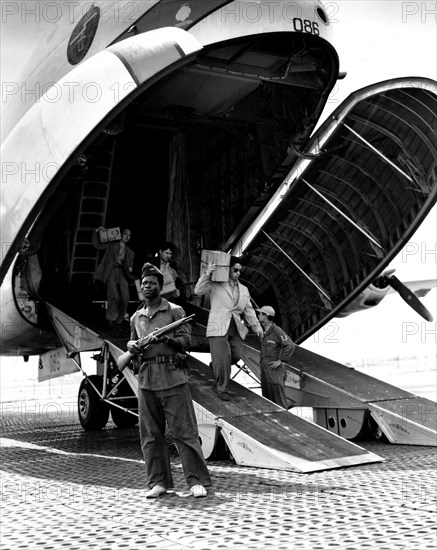 At an airport in Indochina, French personnel getting off a 'Globemaster' (1954)
