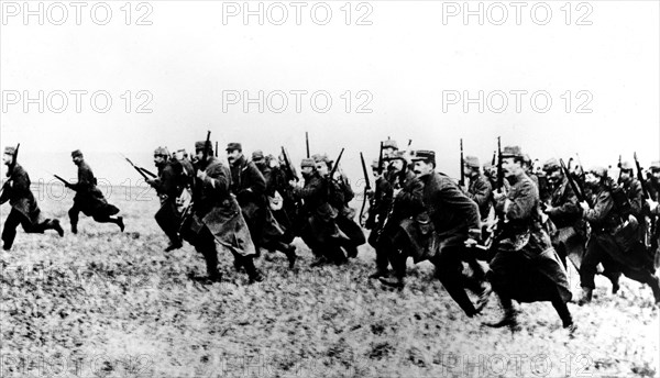 Infantrymen charging with fixed bayonets