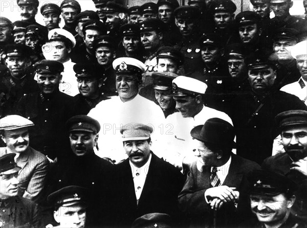 Joseph Stalin (middle), Molotov, (far left). Voroshilov next to Stalin. Kalinin on his right.