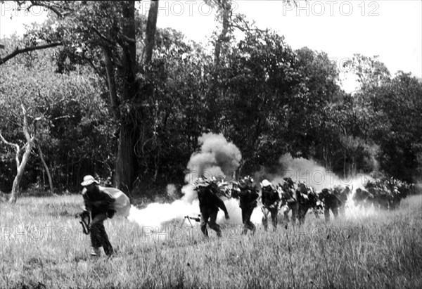 Column of South Vietnam soldiers under fire.