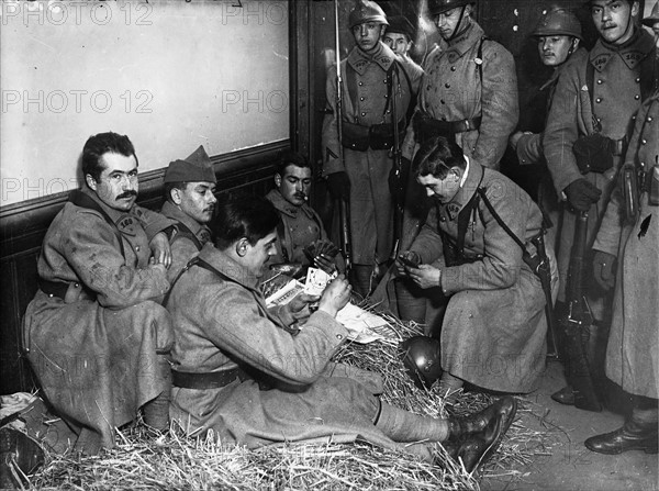 Soldiers playing cards during a break, 1934