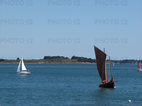 Sailing boats off the coast of the Island de Berder, Brittany (Bretagne)