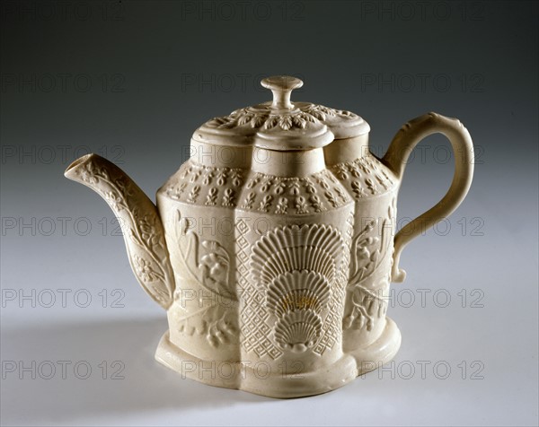 White teapot with oriental style decoration