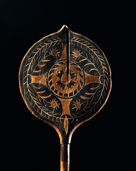 Carved canoe paddle