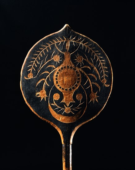 Carved canoe paddle