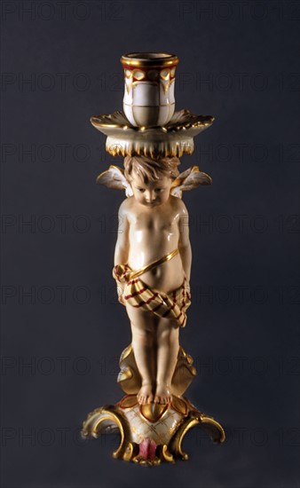 Candlestick with angel with bare chest