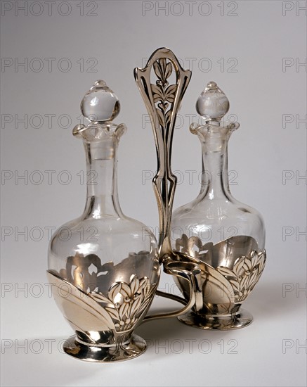 Two bottles and silver metal structure.