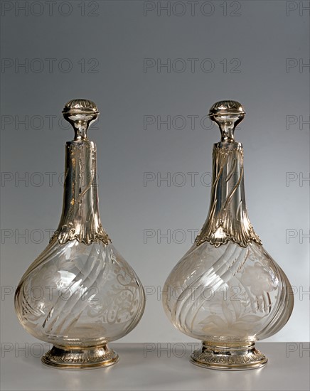 Two bottles in engraved crystal