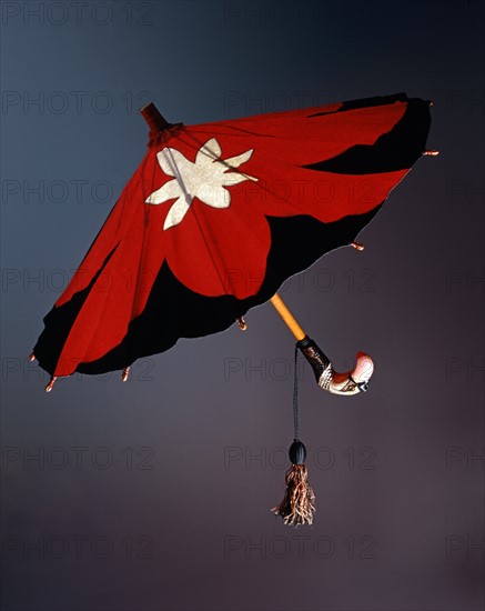 Red and black felt umbrella, with a white stylized star