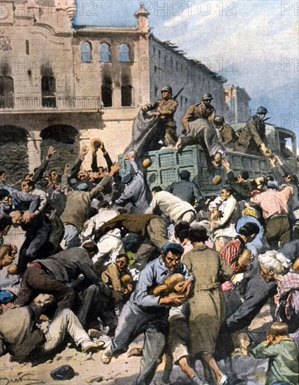 Guerre civile espagnole. Dès leur entrée à Bilbao, où le pain et l'eau manquaient depuis plusieurs jours, les libérateurs ont distribué des milliers de pains à la population affamée (1937)