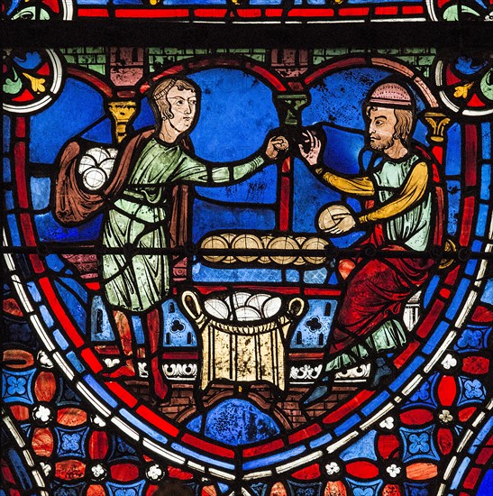 Un homme achète du pain au boulanger (vitrail de Chartres)