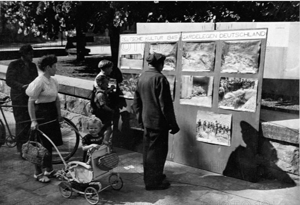 Germans view atrocities pictures in Beckum (May 11,1945)