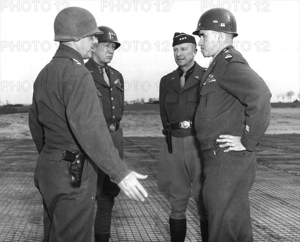 U.S Generals confer on a German airfield (March 20, 1945)