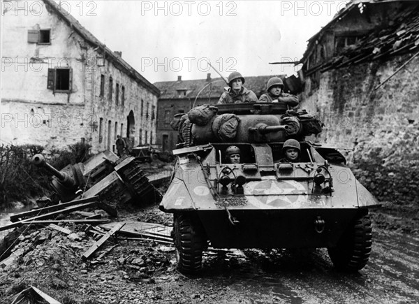 A U.S M-8 reconnaissance armored car in Kinzweiler(Germany) November 1944