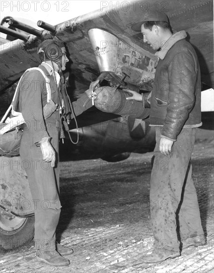 A pilot of the 9th U.S Air Force check-up his plane (April 3, 1945)