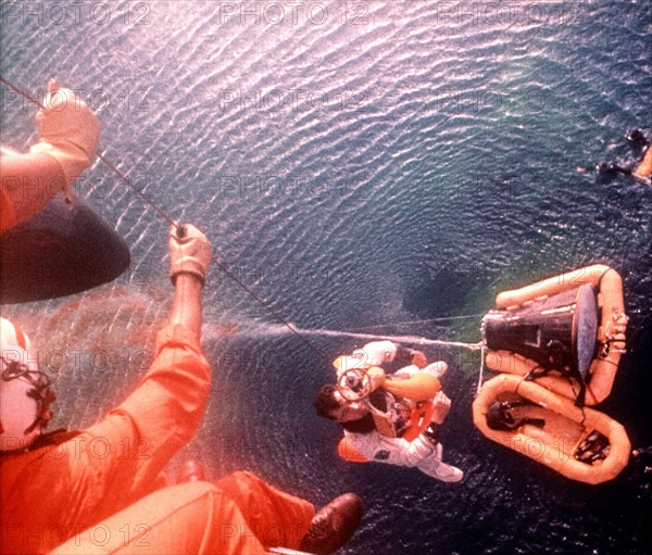Gemini X recovery. Astronaut Young hoisted aboard helicopter (July 21, 1966)