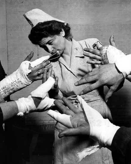 U.S. Army nurse watches group of patients exercice at an hospital in Liege (Belgium) May 3, 1945