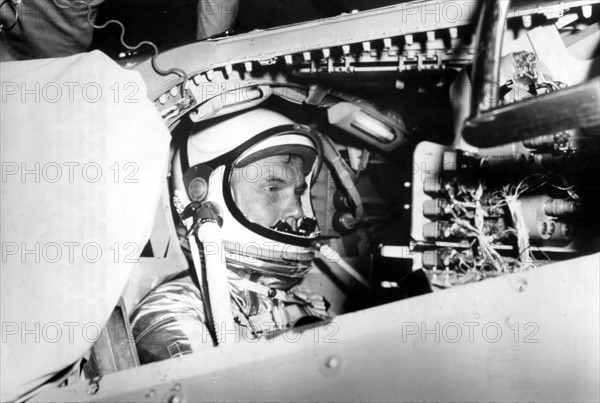 U.S Astronaut John H.Glenn Jr, in procedures trainer at NASA's Mercury Control Center for a simulated Flight (1962)