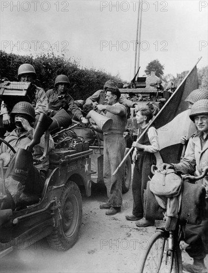 French farmer welcomes American troops in Normandy (June 1944)