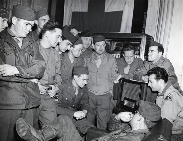 GI's wait for announcement of Germany's total surrender in Paris (May 7, 1945)