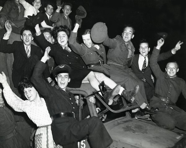 Allied soldiers and French civilians celebrate  Victory in Europe at Paris, May 8, 1945