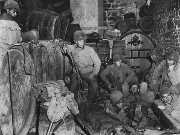 American soldiers take a brief respite in Tessy sur Vire,  August 3, 1944