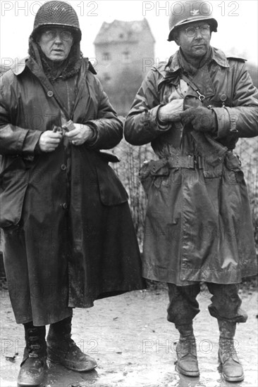 An American General watchs his soldiers crossing the Rhine river at Remagen  in March 1945