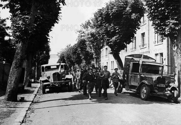 French patriots march through Chateaudun in France, August 17, 1944