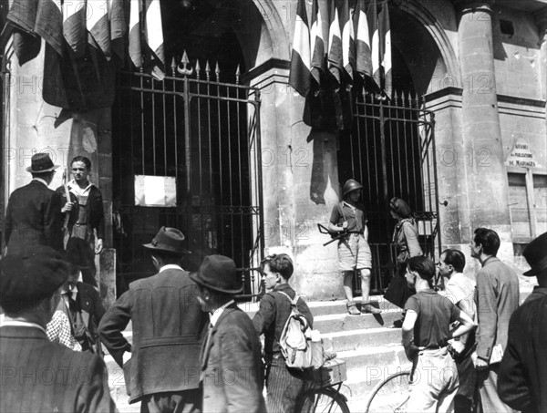 French patriots protect collaborators from crowd at Laval, August 1944