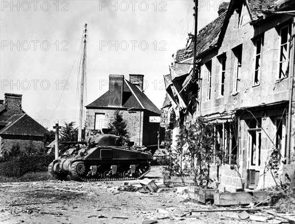 First American tank enters the French town of Perriers, August 1944